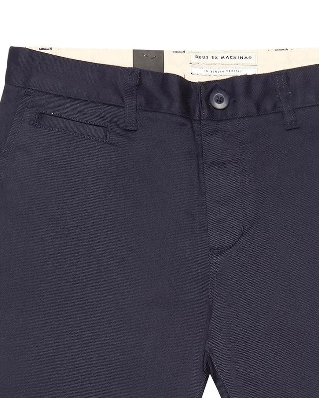 Navy slim fit pant with zip fly closure, back welt pockets, coin pocket detail, 63% poly 34% cotton 3% spandex twill fabrication with a garment wash